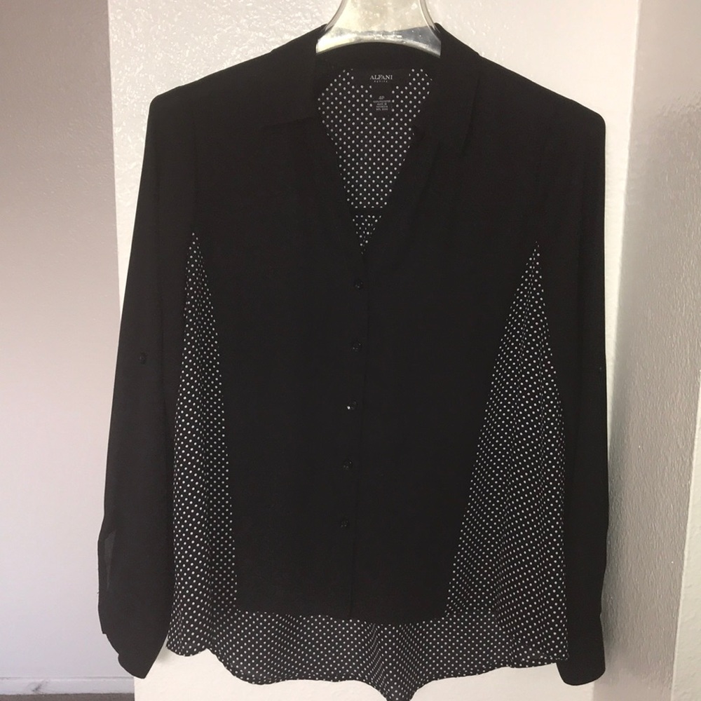 Black polka dotted button down Blouse .